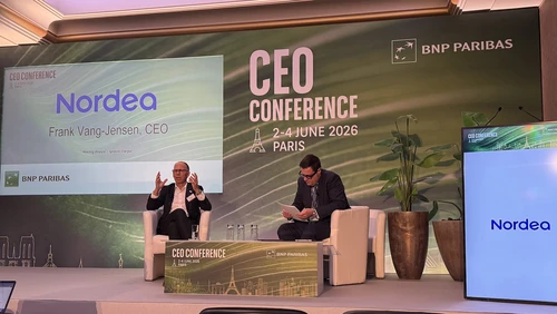 Two men sitting on stage at the CEO conference.