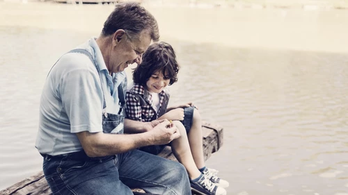 Grandpa and grandson fishing together