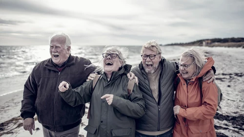 Seniors walking on the beach